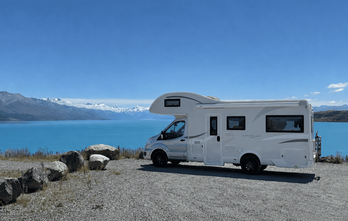 SpringLight motorhome beside a lake in the Mackenzie Country on a 4 week South Island itinerary from Christchurch